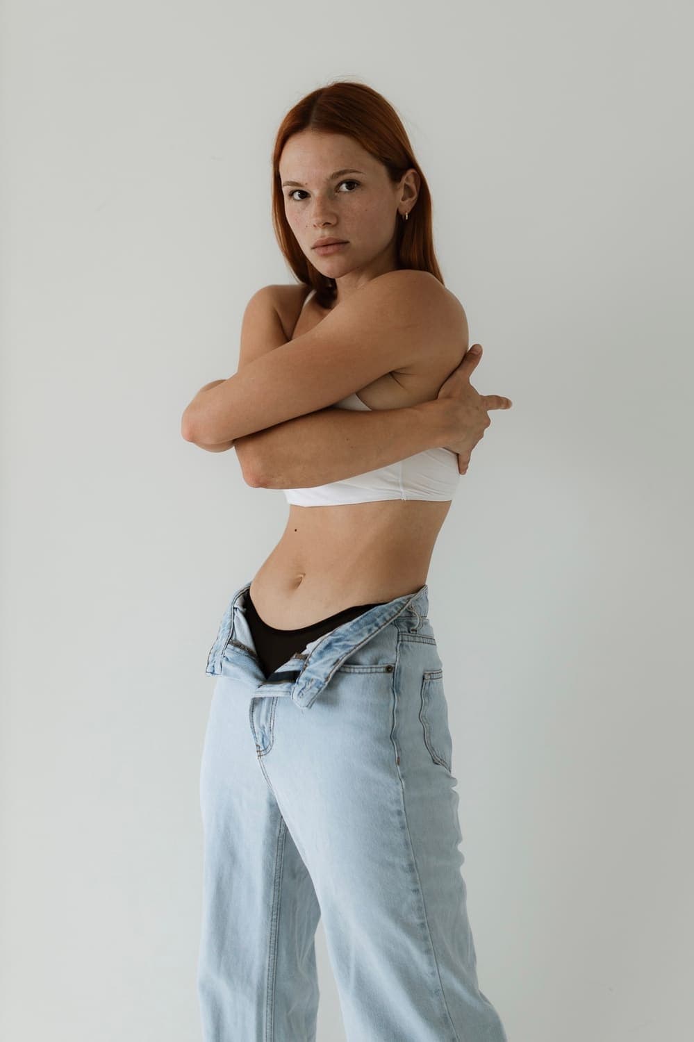 Denim — arms crossed